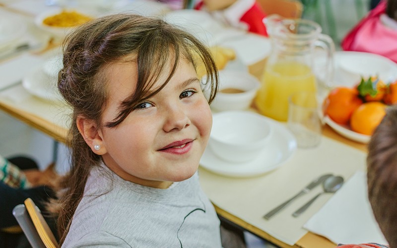 Image of girl eating a healthy lunch.