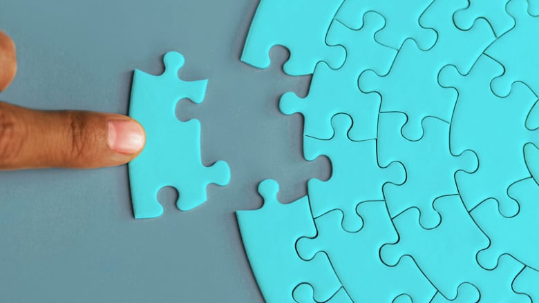 Finger sliding missing puzzle piece into place