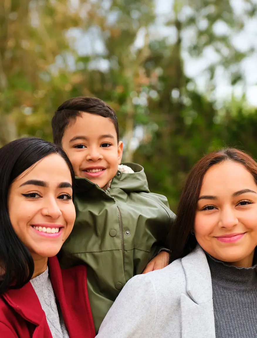 Portrait of latin lesbian couple with their son