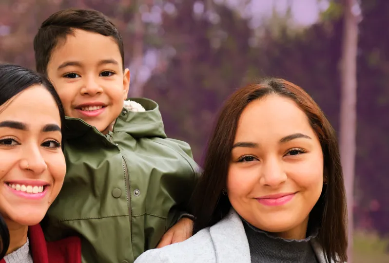 Portrait of latin lesbian couple with their son