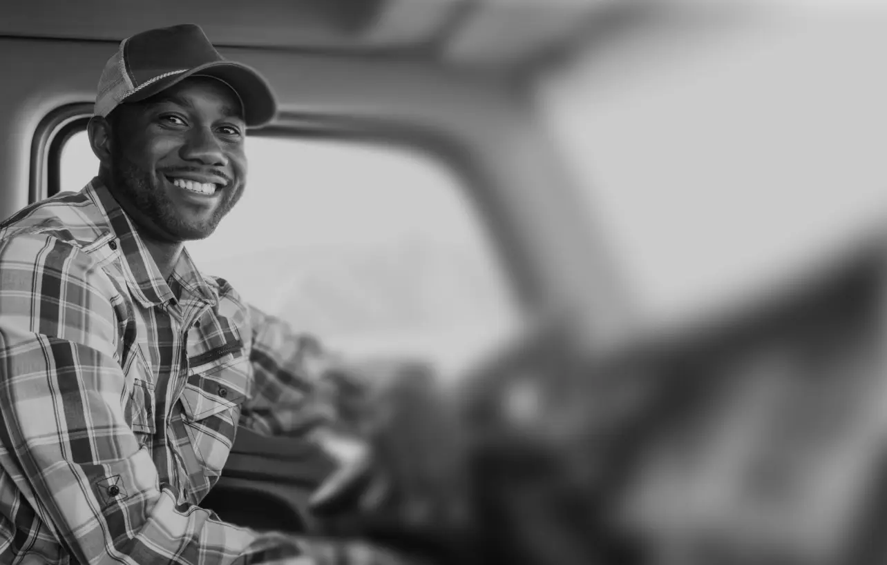 Black man truck driver in the cab