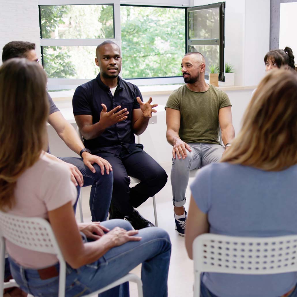 image depicting a group of diverse people discussing ideas
