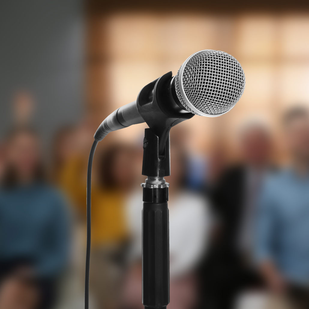 Microphone with blurred people in background
